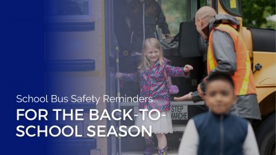 a girl getting off the school bus